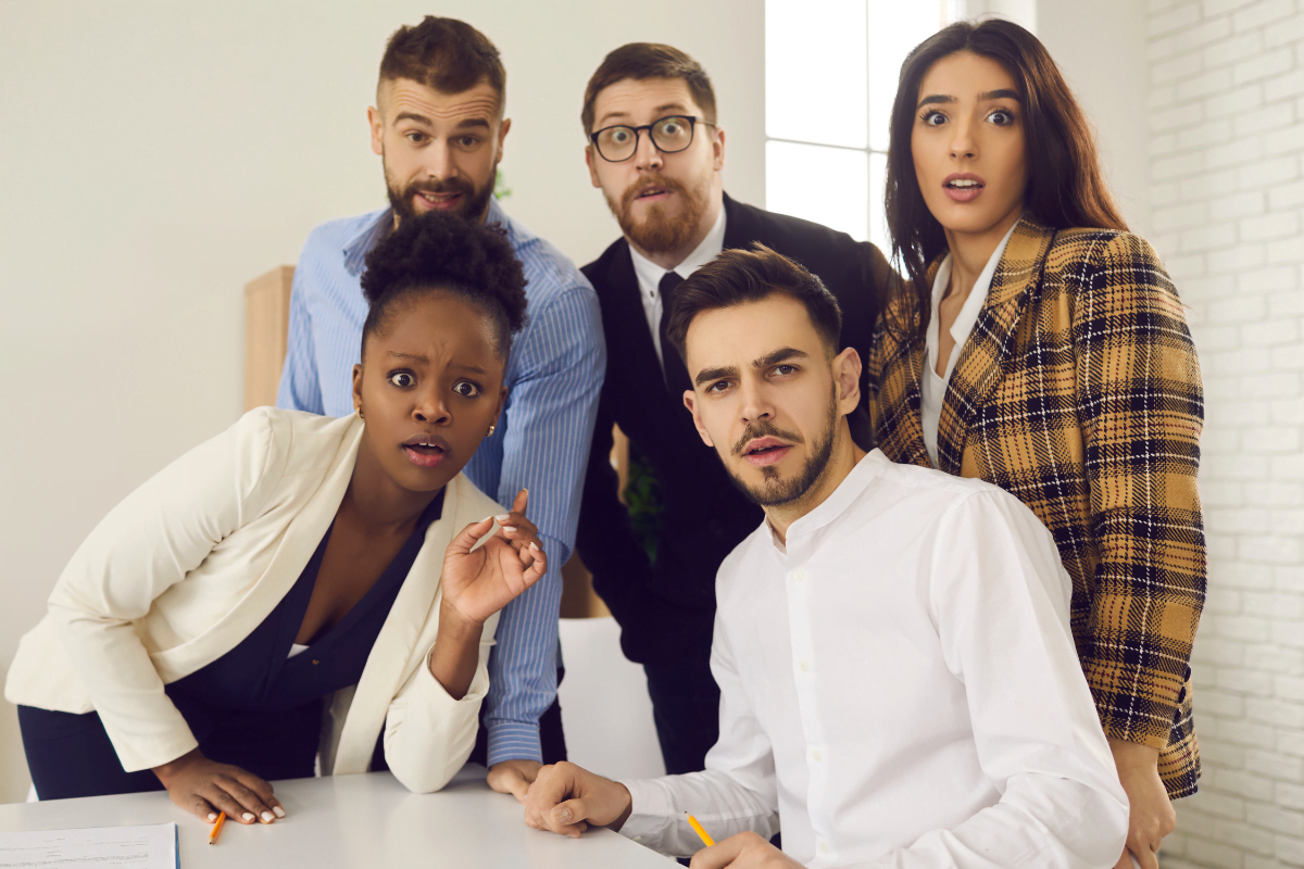 five colleagues looking confused at camera