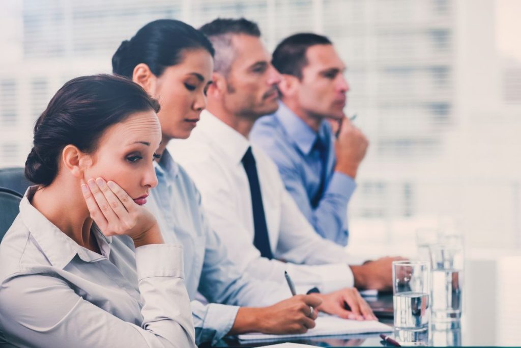 Lady bored in work meeting