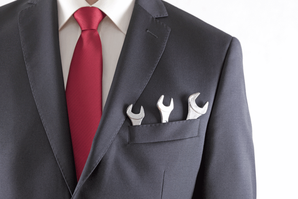 Businessman Suit With Spanners | Axiom Communications