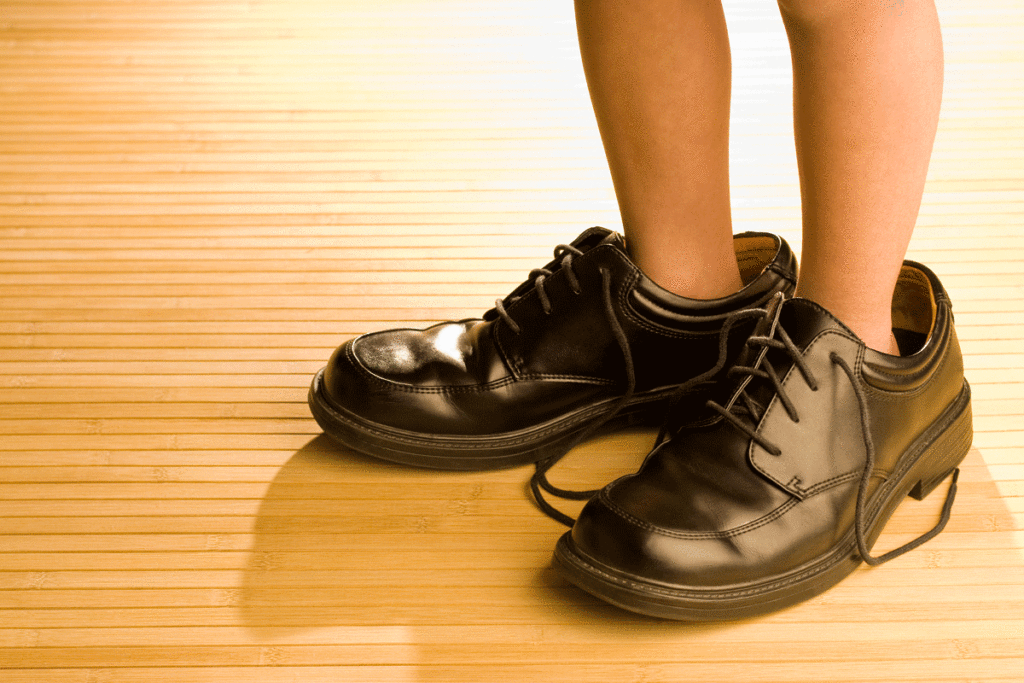 Child Feet In Big Shoes | Axiom Communications