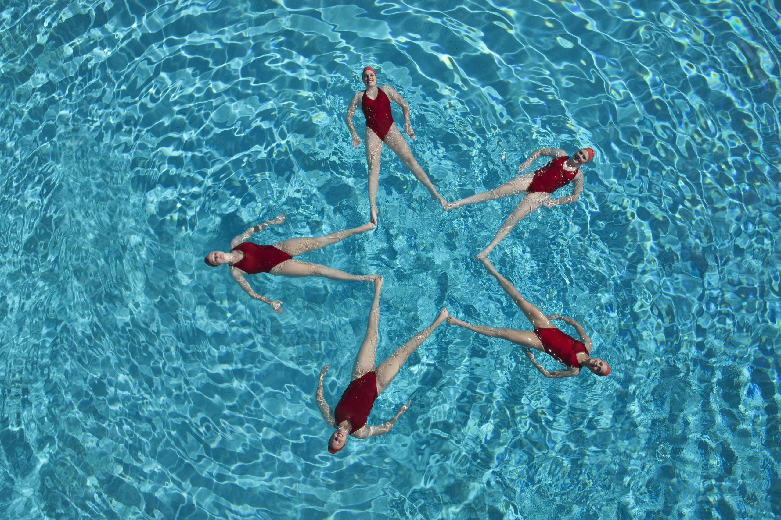 Synchronised Swimmers making star shape | Axiom Communications