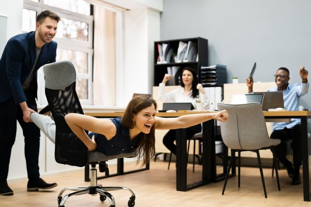 People Celebrating In Office | Axiom Communications