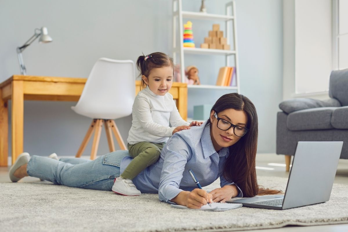 Mother working from home with daughter