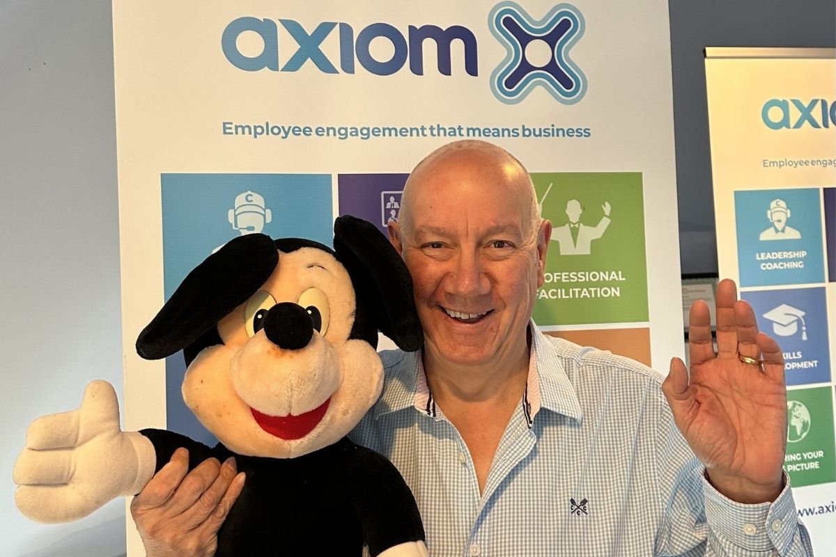 Chris Carey holding Mickey Mouse