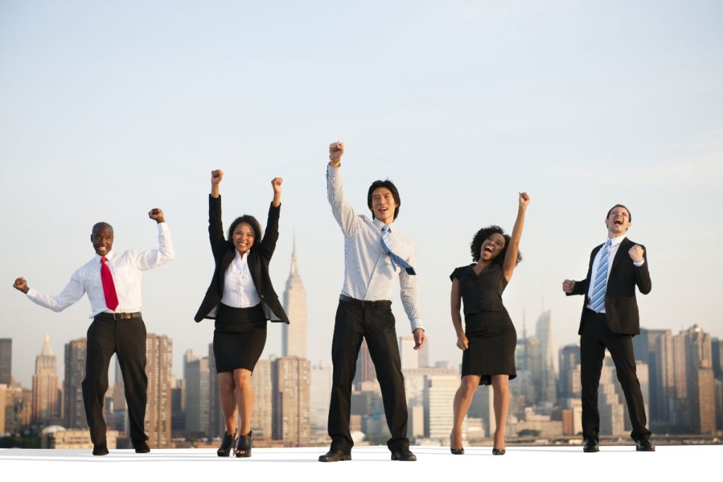 Employees standing on rooftop cheering | Axiom Communications