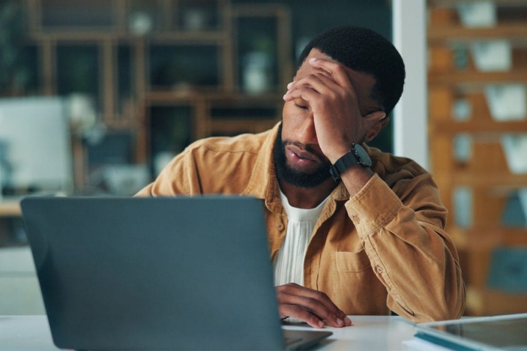 Stressed employee at computer